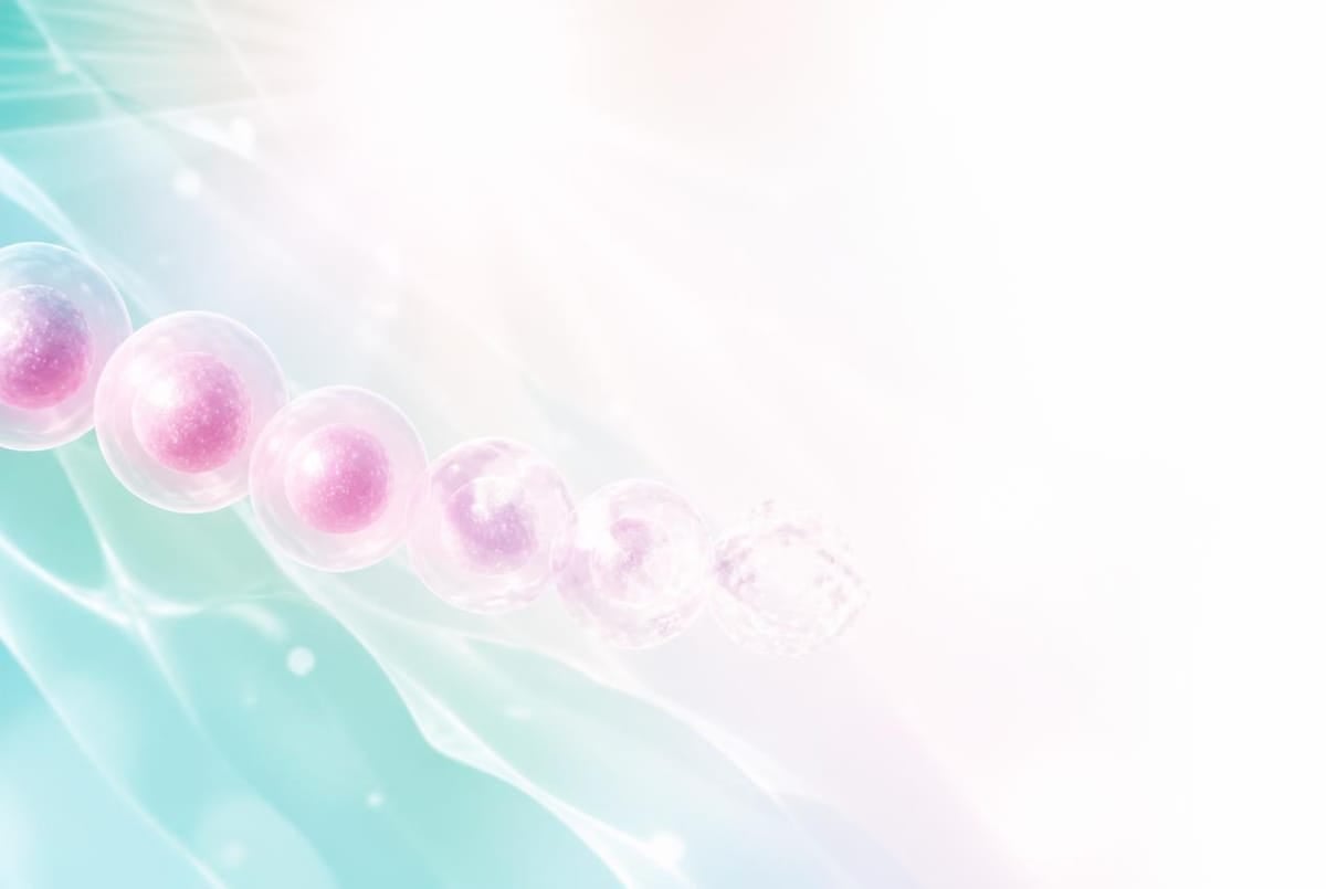 浅色渐变背景上排列成一串的粉色细胞插图
